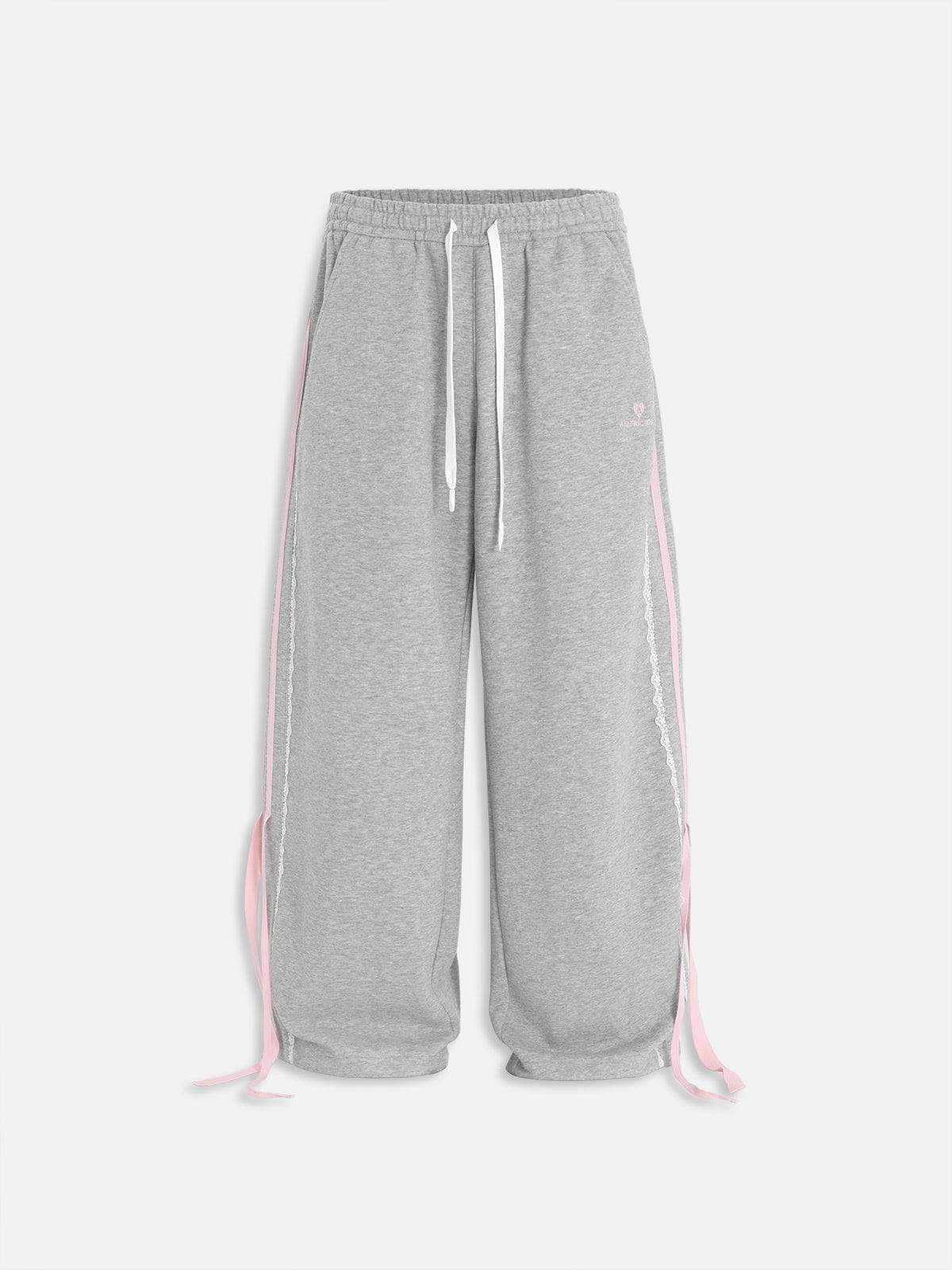 Pantalón baggy con bandas rosas y lazos laterales