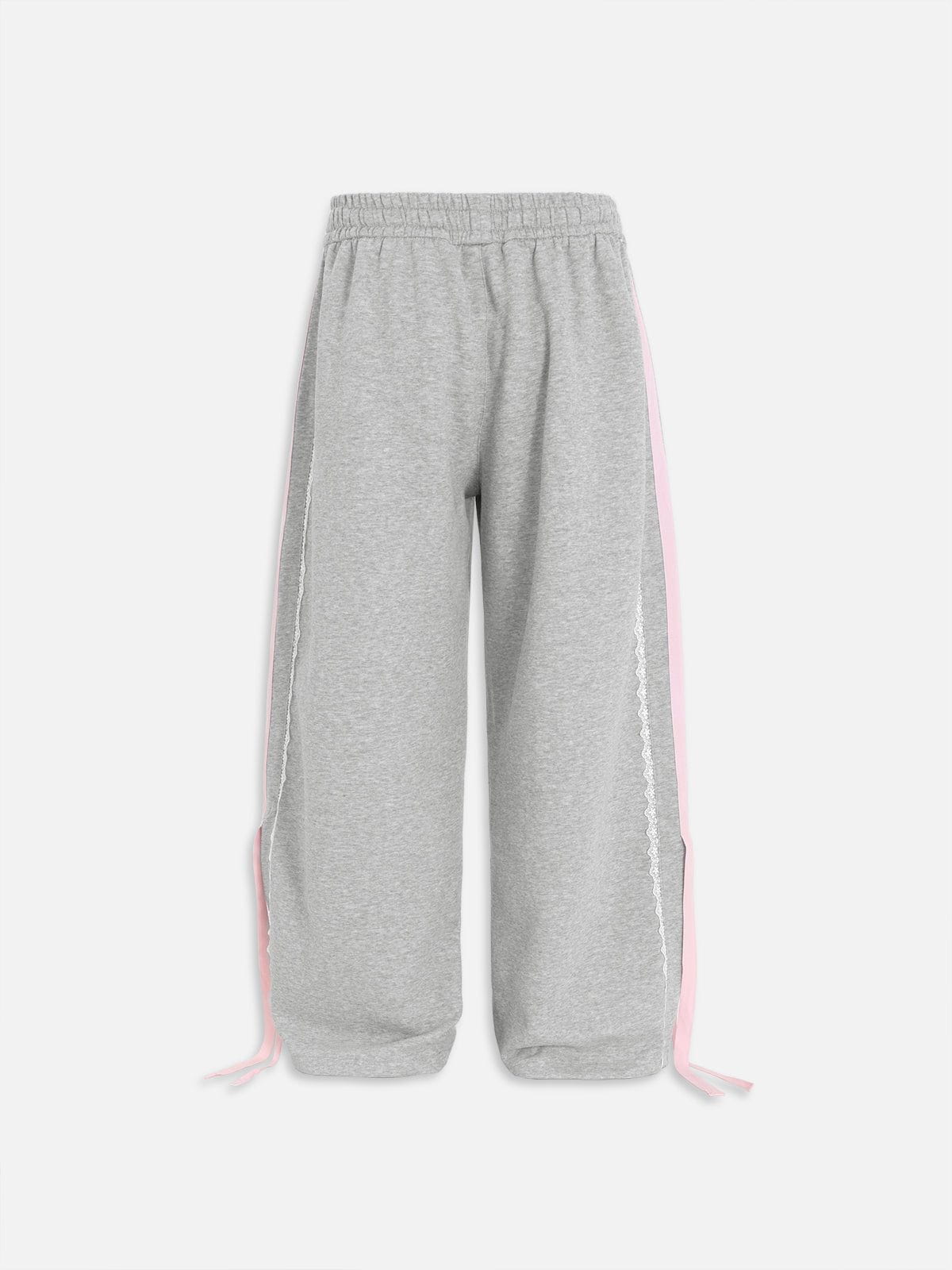 Pantalón baggy con bandas rosas y lazos laterales