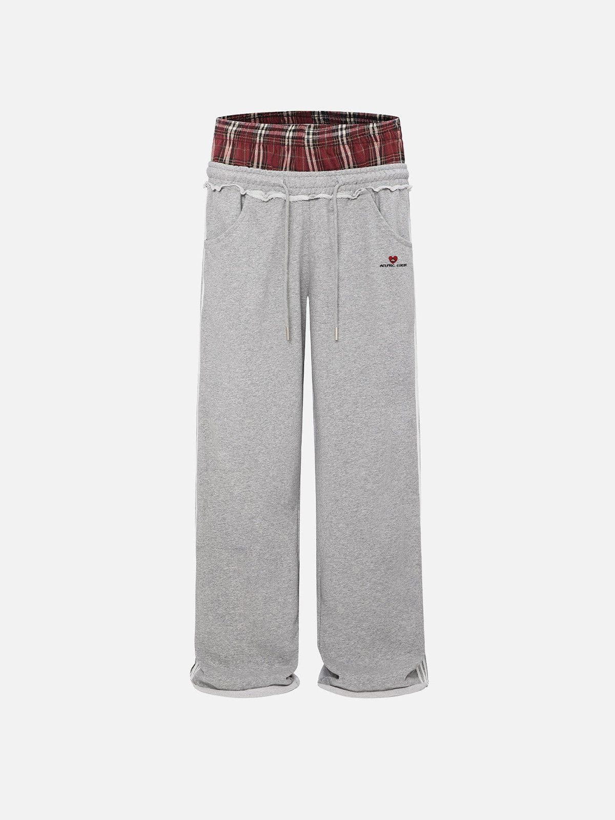 Pantalón ancho relajado con cintura contrastada