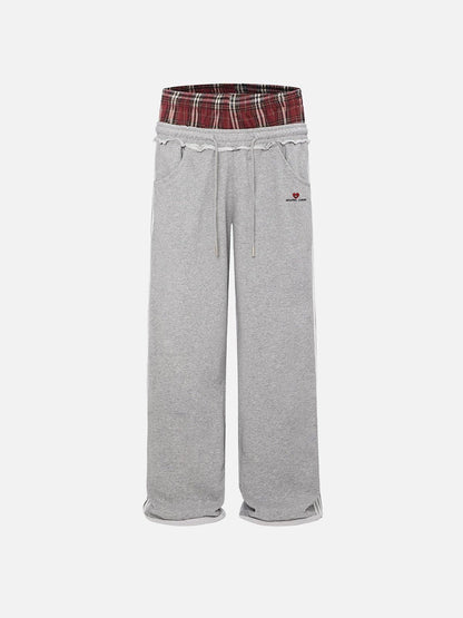 Pantalón ancho relajado con cintura contrastada