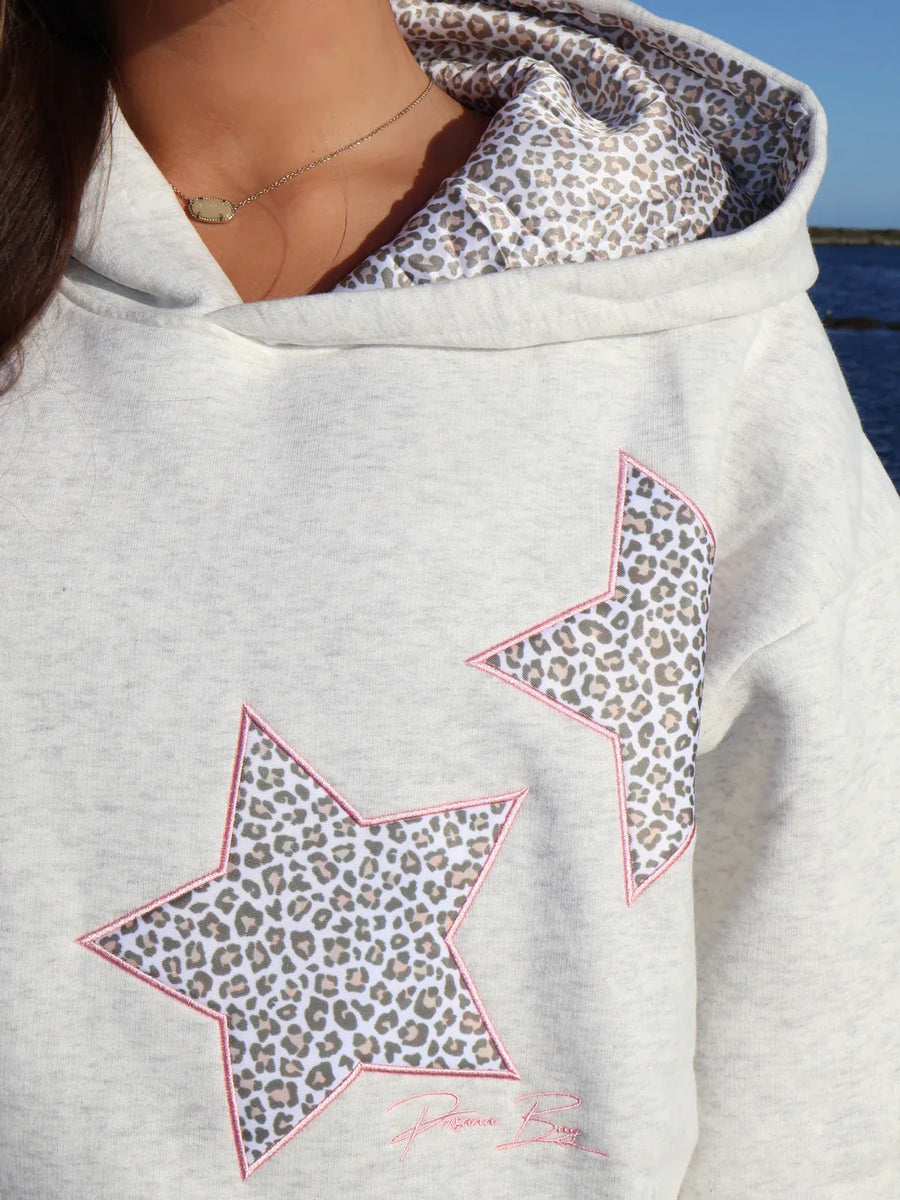 Sudadera con capucha y estrellas animal print
